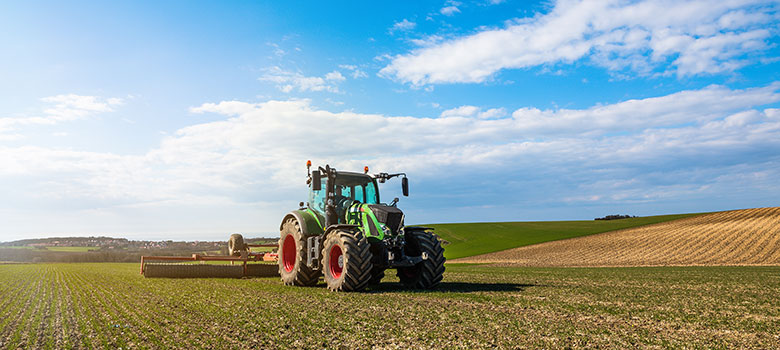 A contract farming tractor on a field