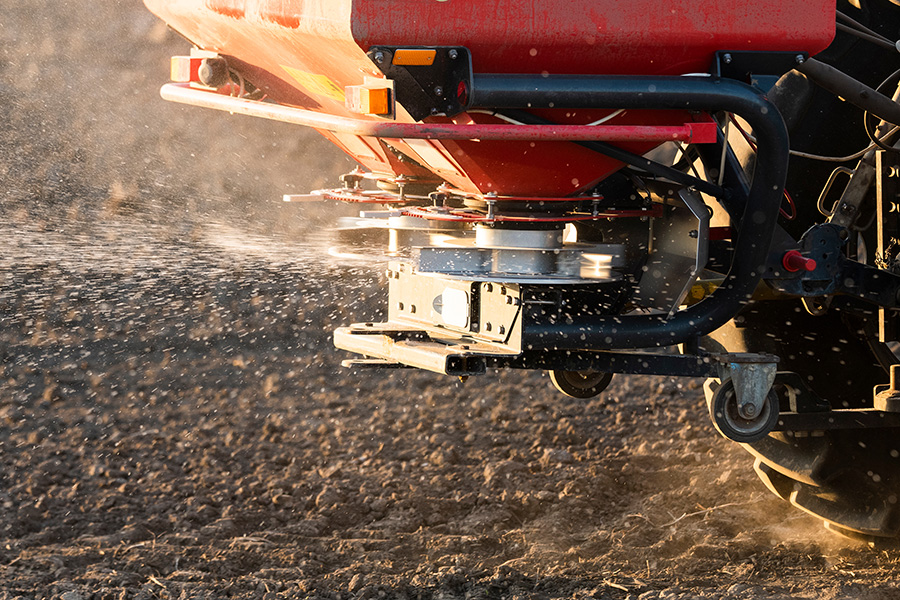 Tractor fertiliser spreading